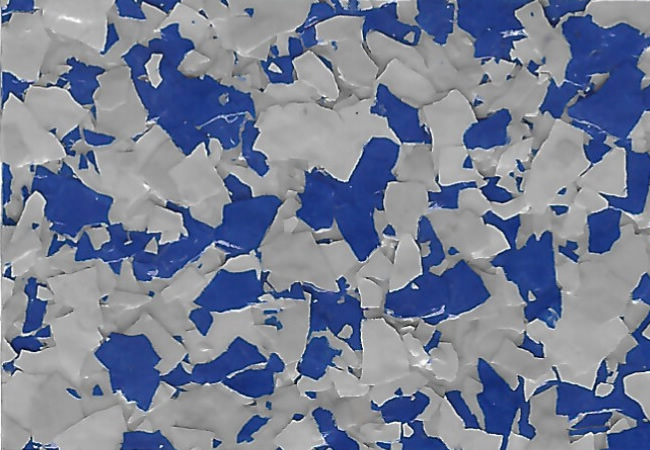 Abstract texture of irregular blue and gray torn-paper fragments scattered across a surface. SA14 Armor Blue
