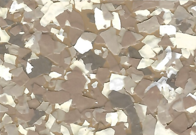 Close-up of a beige-brown speckled terrazzo surface with irregular stone chips like a mosaic countertop.