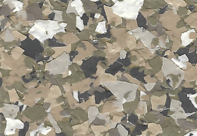 Close-up of a terrazzo floor with multicolored stone chips in white, beige, green, and gray.