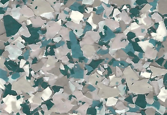 Close-up of teal, white, and gray terrazzo-style floor with irregular chips