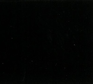 Dark night sky sprinkled with small stars.”,